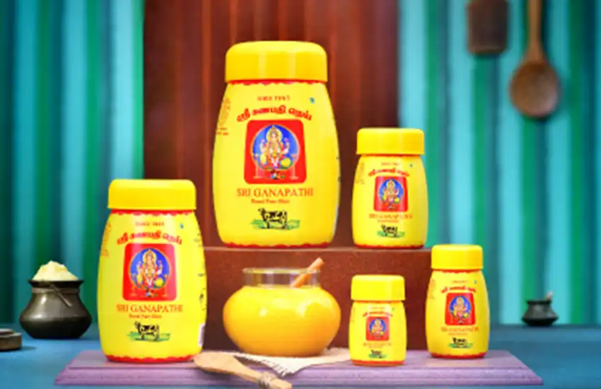A table with several beautifully labeled jars of cow ghee from a ghee manufacturer in Coimbatore.