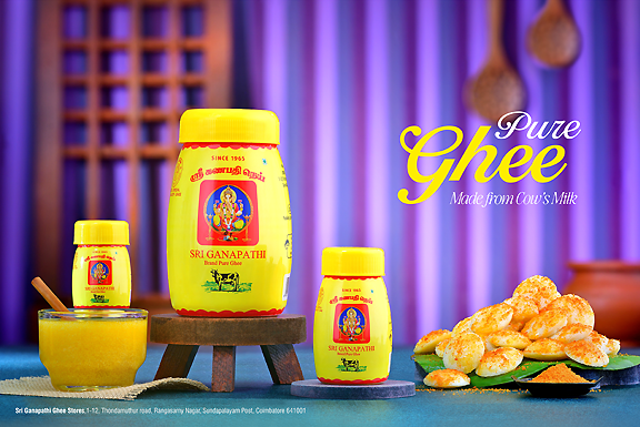 Yellow jars of Sri Ganapathi pure cow ghee displayed alongside a plate of fresh South Indian idlis.