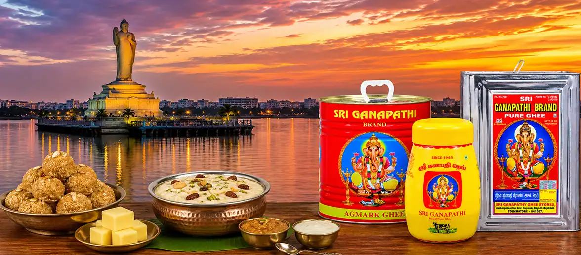 Pure Cow Ghee Containers and Sweets with Hussain Sagar Buddha Statue Hyderabad Background